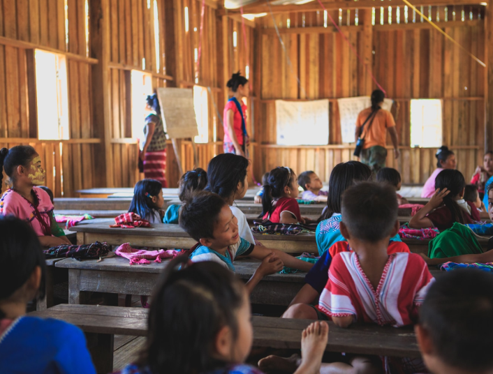 Students learning in a traditional wooden classroom